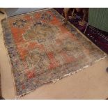 An Antique red ground Persian rug, 190cm x 140cm