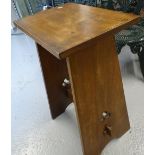 An Arts and Crafts design stool, with pierced tapered sides, W45cm, H73cm