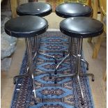 A set of 4 mid-century stools, with black rexine seats on chrome legs