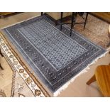 A blue ground Persian design rug, with symmetrical pattern, 190cm x 126cm