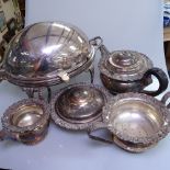 An Edwardian silver plated rollover bacon dish, on cast hoof feet, a 3-piece silver plate on