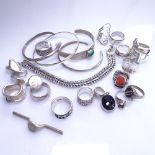 A box containing 19 various silver and stone set dress rings, a pendant, 4 silver bangles, and a