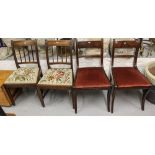 A pair of Georgian oak dining chairs, and a pair of Regency mahogany sabre leg chairs