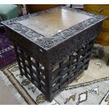 A Chinese rosewood Scribe's travelling writing table, with foldaway stand, with allover relief