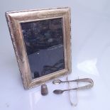 A modern rectangular silver-fronted photo frame, a silver thimble, and 2 silver sugar tongs