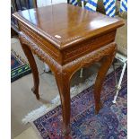 A rectangular carved walnut lamp table, on cabriole legs, W55cm