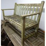 A hardwood slatted and weathered garden bench, W120cm