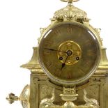 A large 19th century Gothic brass-cased 8-day mantel clock, architectural design case with fleur