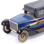 MOTORING INTEREST - a rare tinplate desk stand in the form of a Sedan car, early 20th century, the