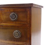 A miniature Edwardian mahogany serpentine-front apprentice chest of drawers, with inlaid cross-