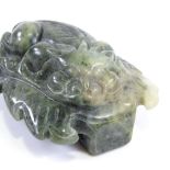 A Chinese spinach green jade relief carved belt buckle, length 6cm