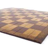 A 19th century mahogany and boxwood roll-up travelling games board, 39cm across