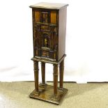 An unusual Antique Italian Arcadian style narrow cabinet on stand, having a single frieze drawer