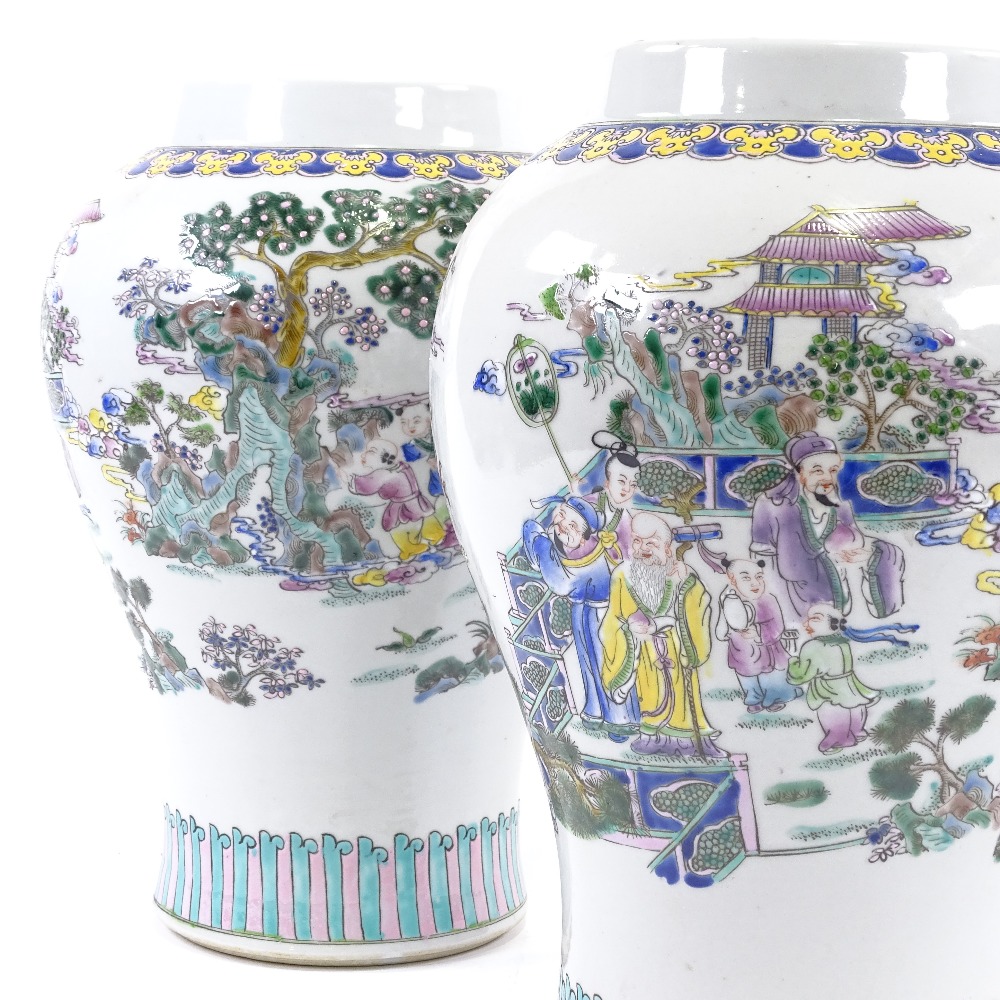 A pair of Chinese porcelain baluster vases, hand painted enamel decoration, 6 character marks,