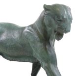 An Art Deco green patinated spelter sculpture of a prowling panther, circa 1930, on original black