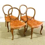 A set of 4 19th century carved walnut balloon-back dining chairs