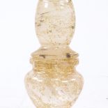 A Middle Eastern gold leaf flecked glass pot and cover, height 22cm