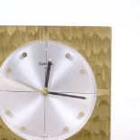 SWIZA - a Vintage brass-cased 8-day desk alarm clock, silvered dial with gilt hour markers and