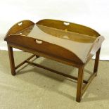 A mahogany butler's tray-top coffee table, with fixed top and drop tray sides, length 99cm, width