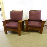 A pair of American oak-framed reclining armchairs