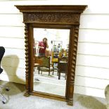 A 19th century French carved oak-framed wall mirror, with barley twist columns, height 1.5m,