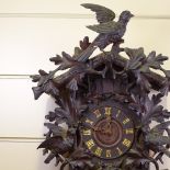 A 19th century German Black Forest wall hanging cuckoo clock, carved and applied oak leaf, acorn and