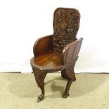 A 19th century Indian hardwood carved chair in the form of a Griffon, height 90cm