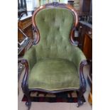 A Victorian mahogany-framed and button-back upholstered armchair, on cabriole legs