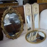 An oval gilt-gesso wall mirror, a gilt-framed over mantel wall mirror, and a pair of cream painted