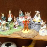 A Royal Doulton display stand, and a selection of Bunnykins figures