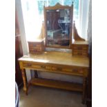 An Arts and Crafts ash dressing table, with bevelled swing mirror, with 2 frieze drawers, raised