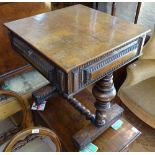 A 19th century Portuguese rosewood sewing table with rising top, carved panelled surround, on turned