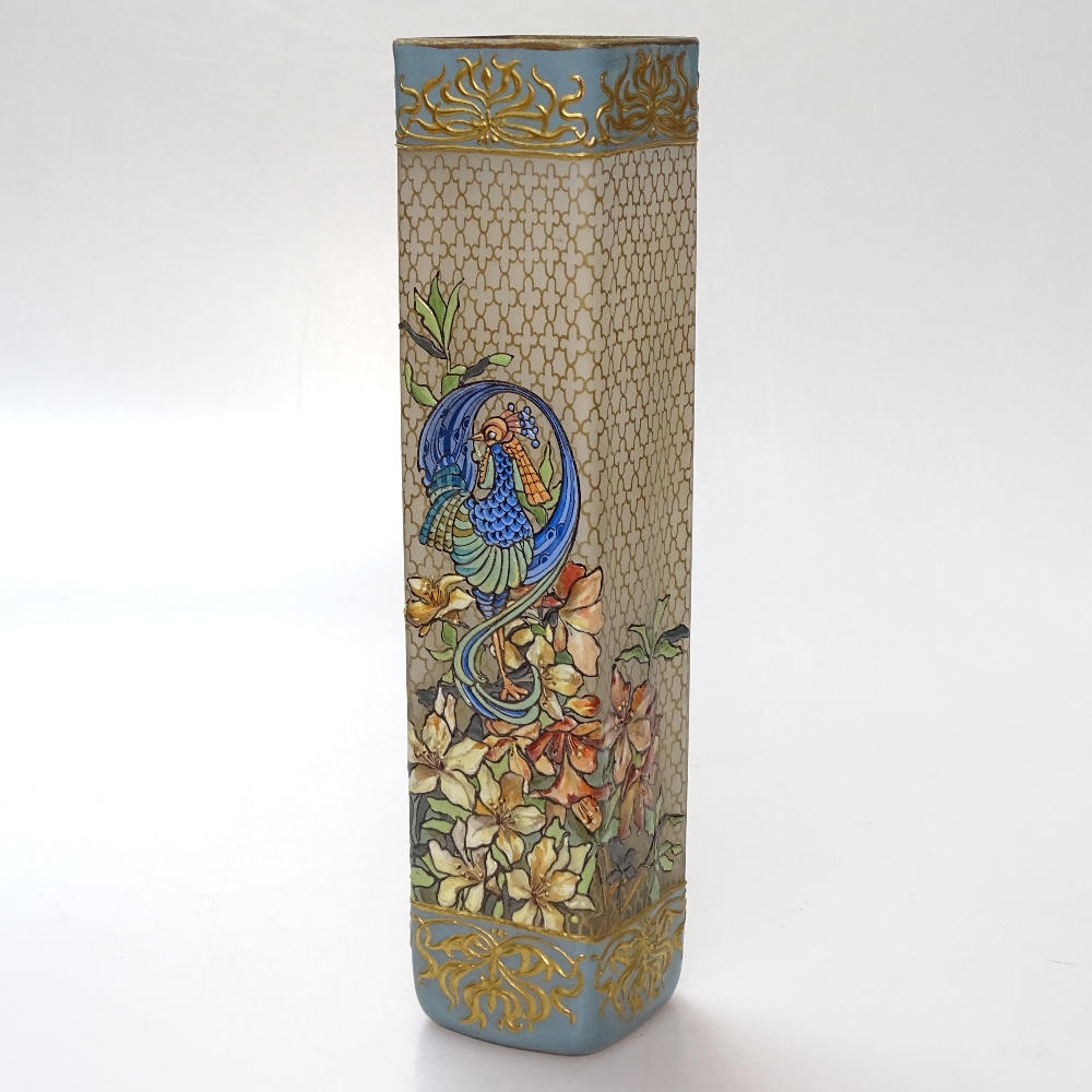 An Art Nouveau square section opaque glass vase, with painted enamel peacock and floral designs,