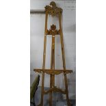 A reproduction carved hardwood folding artist's easel