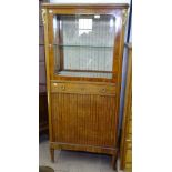 A Continental walnut and kingwood display cabinet, with a coloured red marble top, glazed and