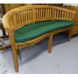 A hardwood banana bench with cushion