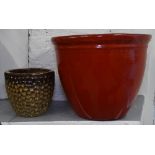 A red glazed circular garden pot, and a small brown glazed pot (2)