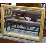 An Antique giltwood and gesso-framed wall mirror, 91cm x 122cm
