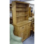 An Antique polished pine 2-section kitchen dresser, W96cm