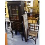 An Antique oak 2-section cabinet on drawer fitted stand, raised on cabriole legs, a bobbin turned