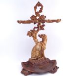A Victorian painted cast-iron umbrella/stick stand, seated dog and floral decoration, overall height