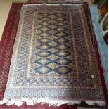 An orange ground Afghan design rug, 180cm x 125cm