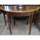 A Regency mahogany and satinwood banded demilune console table, raised on tapered legs and spade