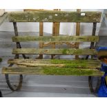 A Victorian scrolled wrought-iron garden bench with slatted seat, W100cm