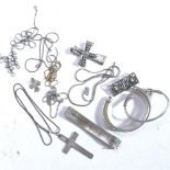 A collection of silver jewellery, to include crucifixes, bracelets and brooches, 4.3oz