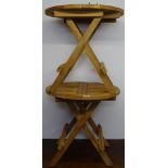 A pair of small teak folding garden occasional tables