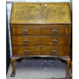 A 1930s walnut 3-drawer bureau, W74cm