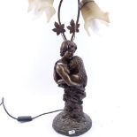 An Art Nouveau style resin embracing couple table lamp, overall height 66cm