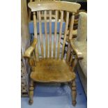 A Vintage kitchen elm-seated Windsor elbow chair