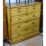 An Arts and Crafts ash chest of 2 short and 3 long drawers, W121cm